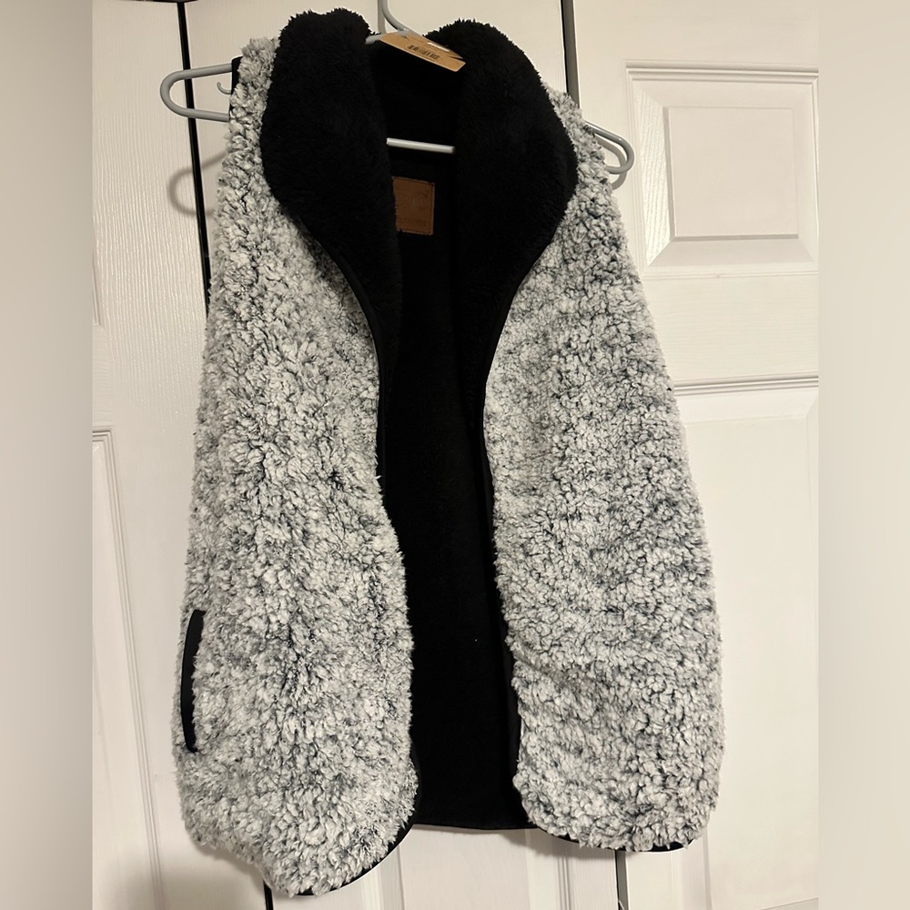 NWT. CC exclusive Sherpa vest. Reversible. Thick, warm and cozy. Size XS.